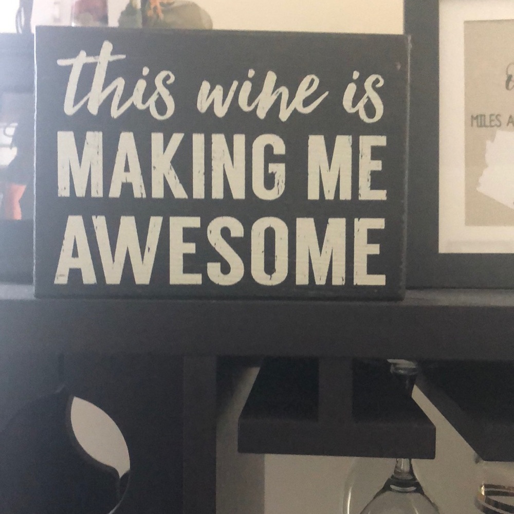 distressed wooden wine sign